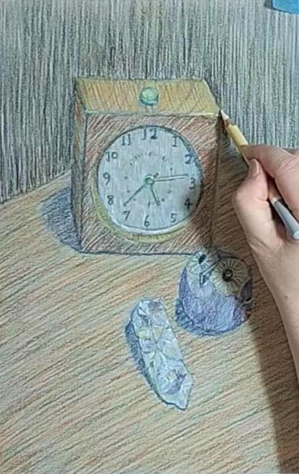 時計のハイライトを描いている様子